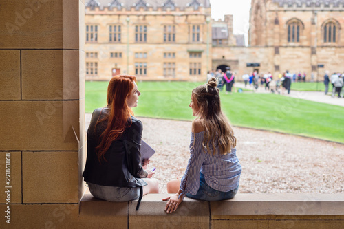 students chatting on campus photo