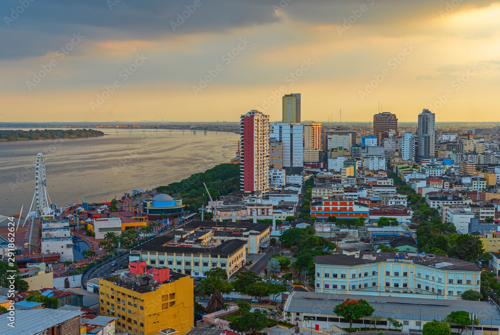Cityscape of Guayaquil city at sunset with the Guayas river and ...