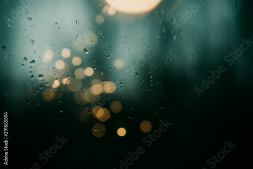 rain on window with bokeh photo
