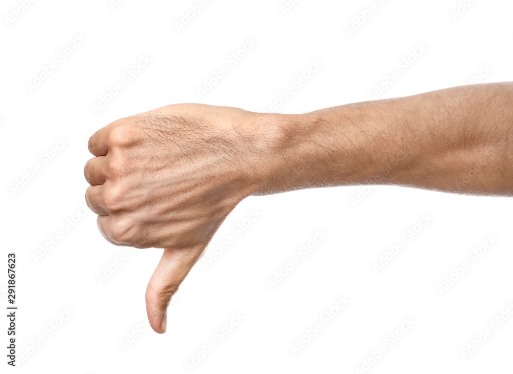 Male hand showing thumb-down gesture on white background Male hand showing thumb-down gesture on white background