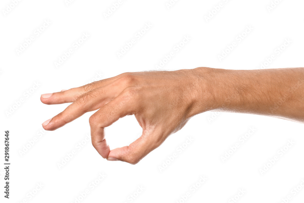 Male hand showing OK gesture on white background