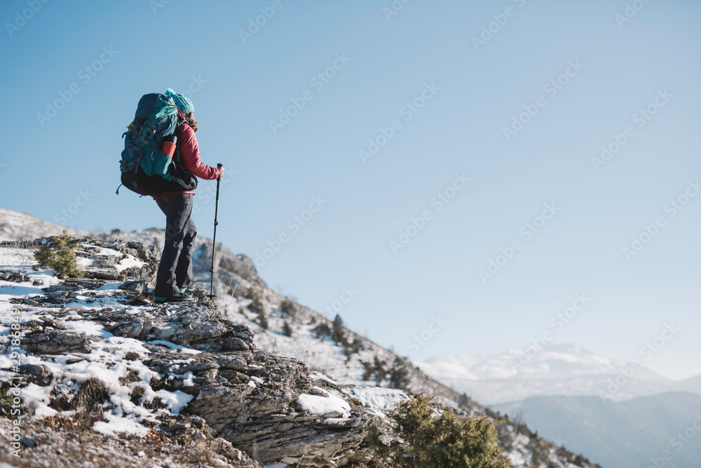 hiker with sticks thru the mountain hiker with sticks thru the mountain