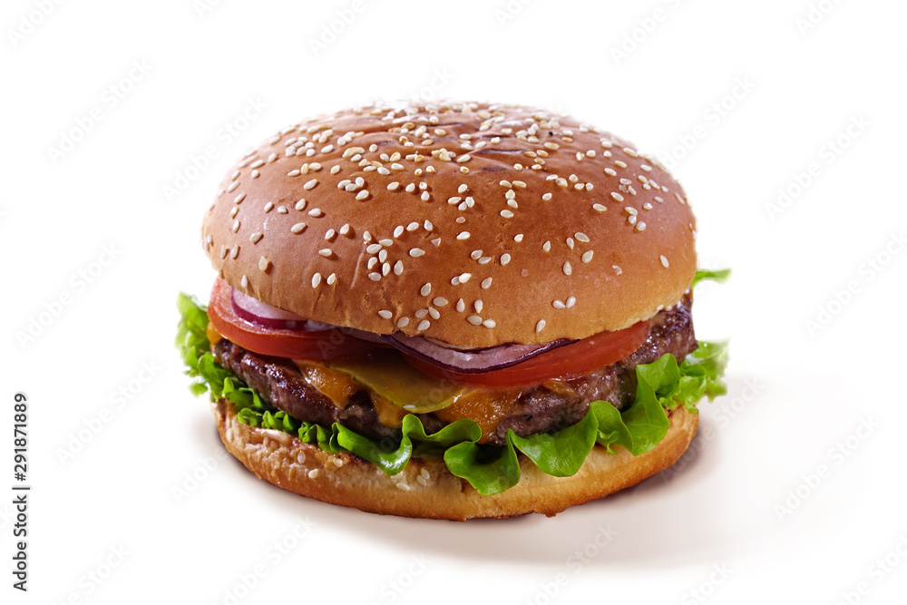 Delicious juicy hamburger with tomatoes, herbs, cheese and meat isolated on a white background. Tasty burger isolated on white with sesame.