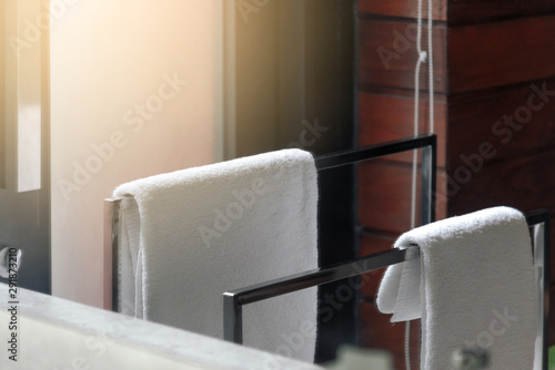 White clean towel hanging on towel rack in the bathroom