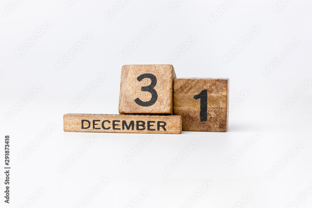 Business and design concept - geometric floating wooden cube on white background. 31st Desember. Happy New Year. Business and design concept - geometric floating wooden cube on white background. 31st Desember. Happy New Year.