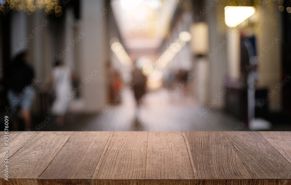 Empty dark wooden table in front of abstract blurred bokeh background of restaurant . can be used for display or montage your products.Mock up for space. Empty dark wooden table in front of abstract blurred bokeh background of restaurant . can be used for display or montage your products.Mock up for space.