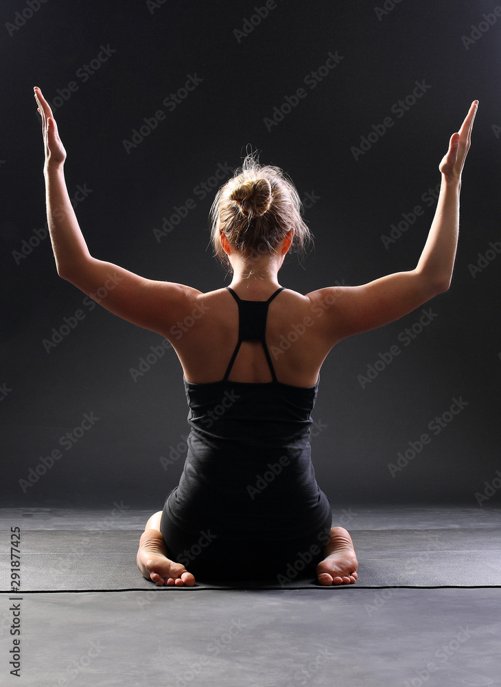 Yoga Time. Little Girl Practicing Yoga, Sitting In Yoga Pose Lifting Her Hands  Up, On Yoga Mat Stock Photo, Picture and Royalty Free Image. Image 53678621.