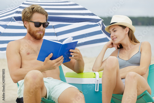 romantic couple relaxing on beach