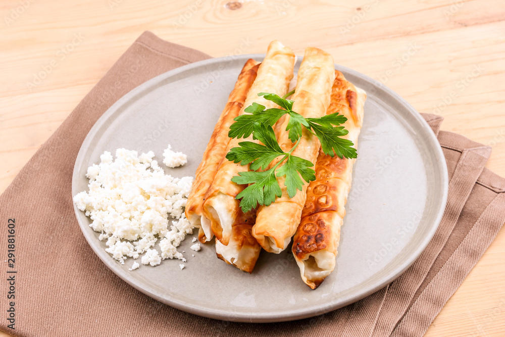 Traditional Turkish Pastries sigara borek - Deep Fried pies with cottage cheese and parsley. Traditional Turkish Pastries sigara borek - Deep Fried pies with cottage cheese and parsley.