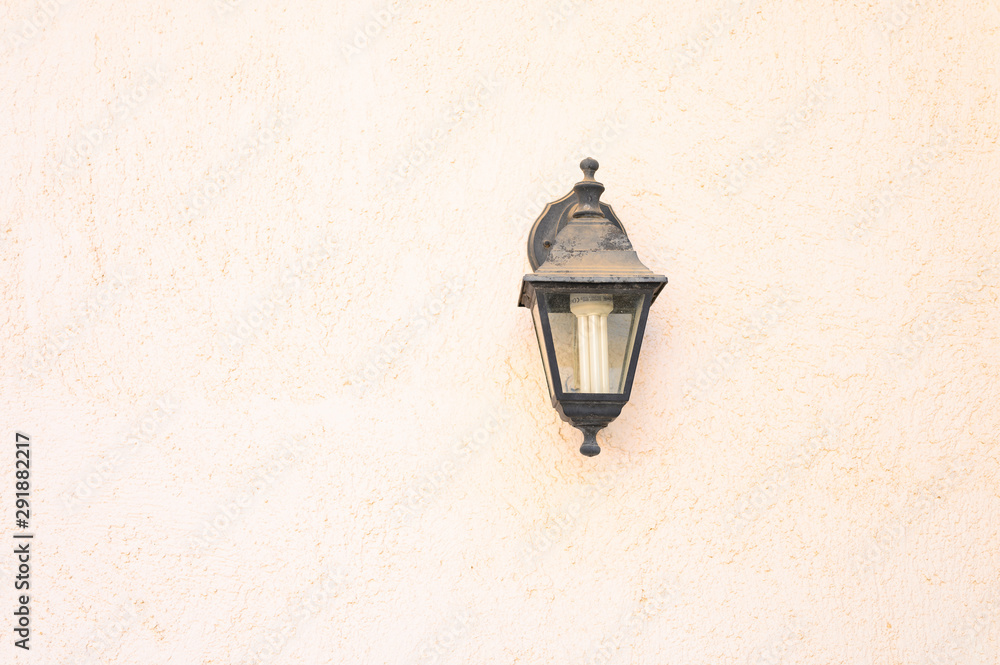the old wall street lamp on textured background