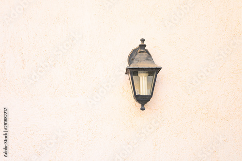 the old wall street lamp on textured background