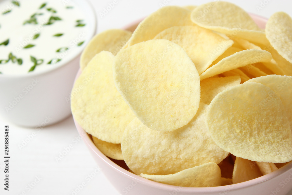Potato chips and sauce on the table. Potato chips and sauce on the table.