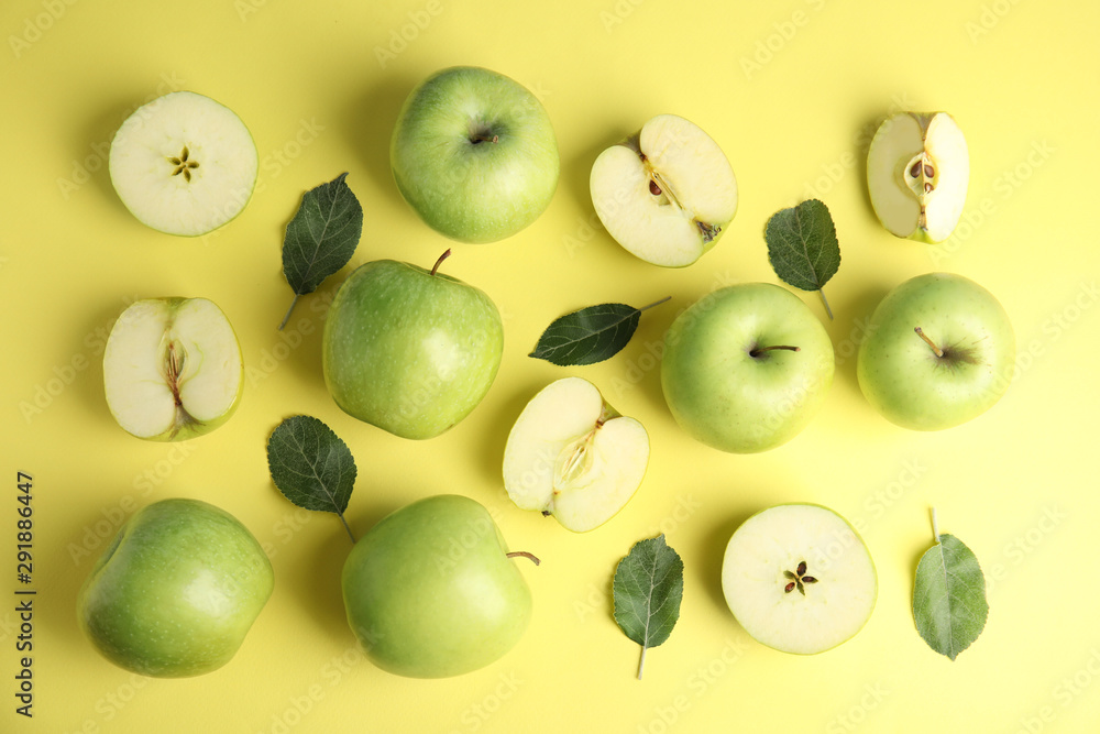 Flat lay composition of fresh ripe green apples on yellow background Flat lay composition of fresh ripe green apples on yellow background