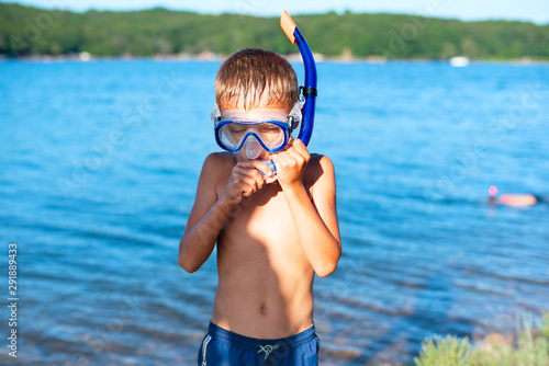 Boy in a diving mask on the beach Sea tourism travel