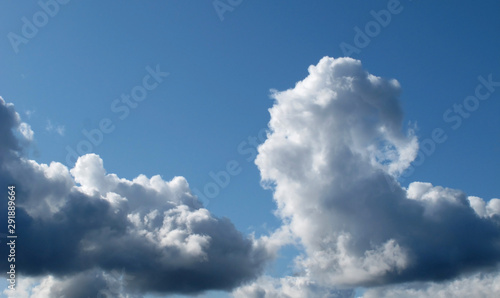 Cumulonimbus cumulus clouds against blue sky