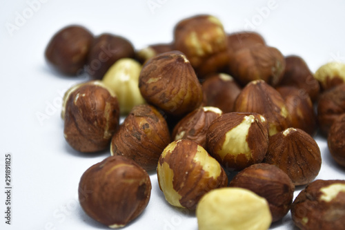 Heap of hazelnuts on a white background. Raw hazelnuts isolated on white background.