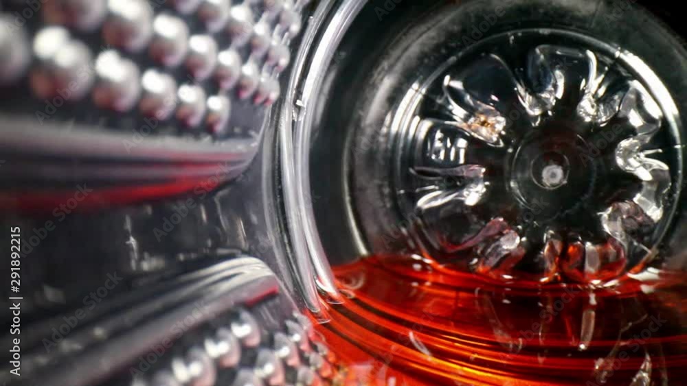 pulling out of bottom of sport drink or juice bottle on left side; wall of bottle has many features. straw & red liquid are revealed. Using a wide angle probe lens, getting unique perspectives. pulling out of bottom of sport drink or juice bottle on left side; wall of bottle has many features. straw & red liquid are revealed. Using a wide angle probe lens, getting unique perspectives.