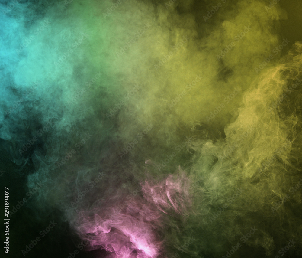 Abstract smoke on a dark background.  Movement of color smoke