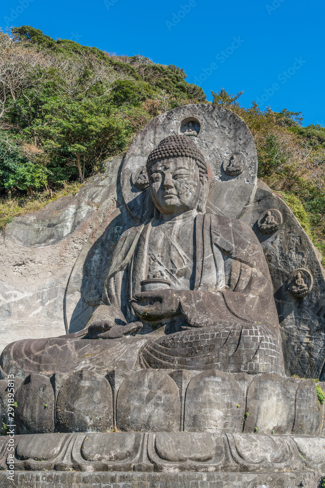 Mount Nokogiri (Nokogiriyama) Great Buddha (Nihon-ji daibutsu). Carving of seated sculpture of Yakushi Nyorai completed in 1783. The largest pre-modern stone-carved Daibutsu in Japan Mount Nokogiri (Nokogiriyama) Great Buddha (Nihon-ji daibutsu). Carving of seated sculpture of Yakushi Nyorai completed in 1783. The largest pre-modern stone-carved Daibutsu in Japan