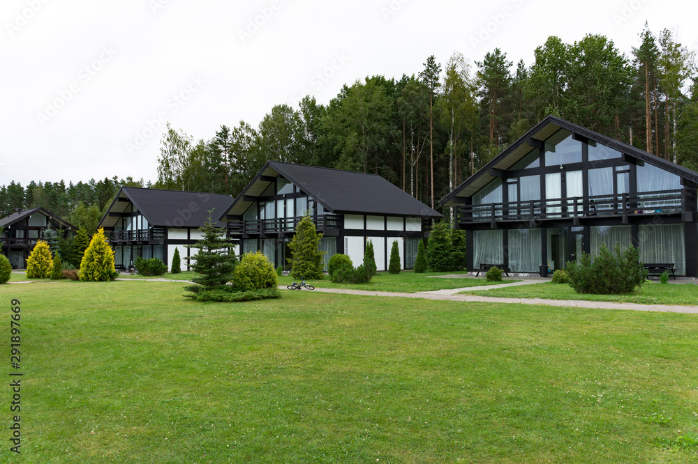 Scandinavian-style cottage village in the woods and gardens