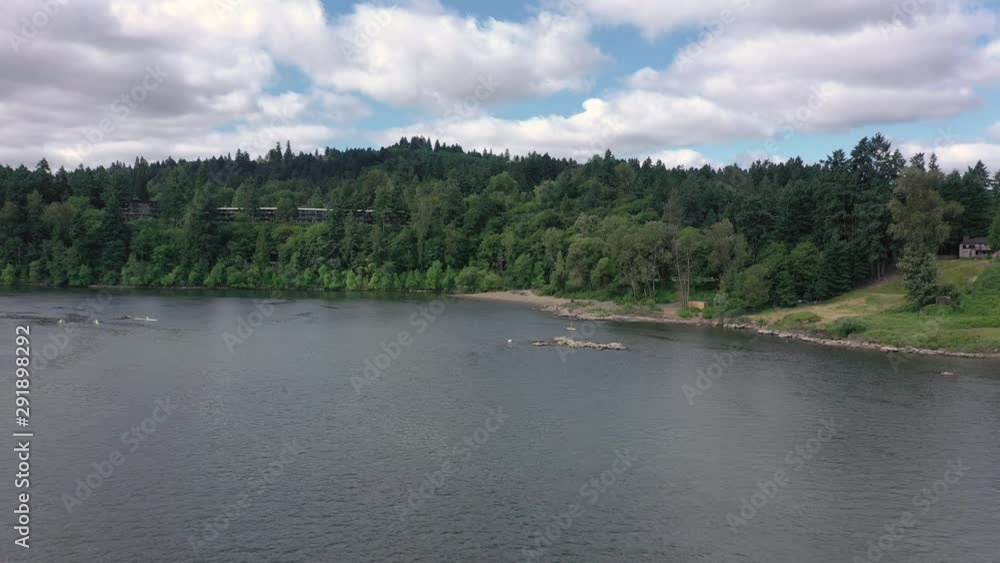 aerial dolly forward towards lake oswego beach and park