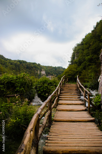 Wooden road leading to the mountains.