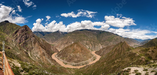 Chinese Horseshoe Bend in the Jinsha River ("Gold Dust River"), the Chinese name for the upper stretches of the Yangtze River. Multi shot high resolution panorama under a blue sky. Horizontal