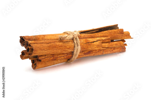 Close-up of Cinnamon sticks heap isolated on white background.