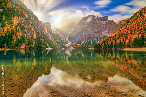 Breathtaking autumn scenery of Braies Lake, Dolomite Alps, Italy photo