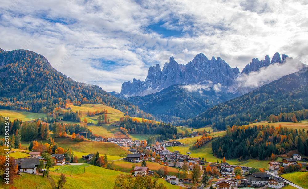 Colorful autumn scenery in Santa Maddalena village at sunny day. Dolomite Alps, South Tyrol, Italy.