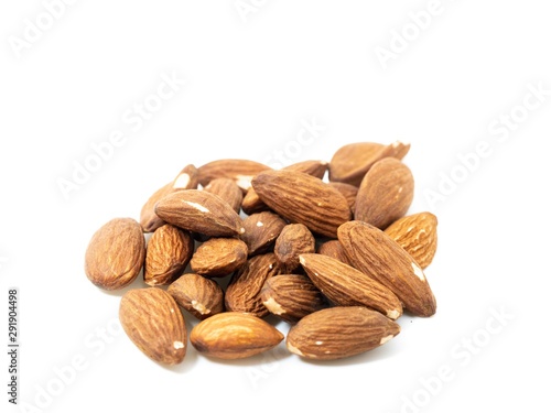 stack of almonds white background soft focus