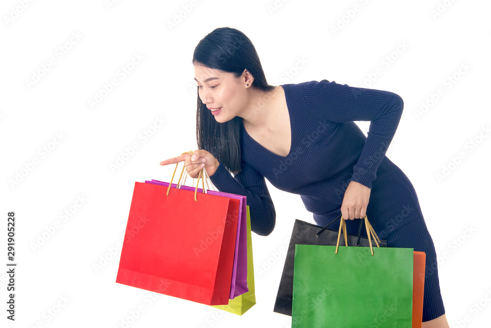 Asian beautiful woman hold shopping bag on her hand and point finger to product
