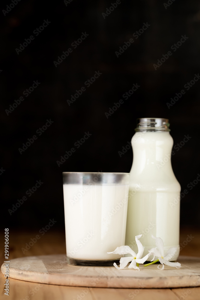 Glass of milk and a bottle of fresh milk Glass of milk and a bottle of fresh milk