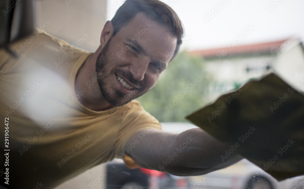 Now is clean. Man cleaning car. Now is clean. Man cleaning car.