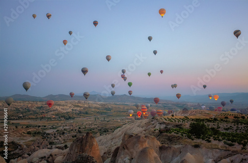 Interesting rocky terrain and a lot of airy multicolored balls in the air. Turkey. Cappadocia.