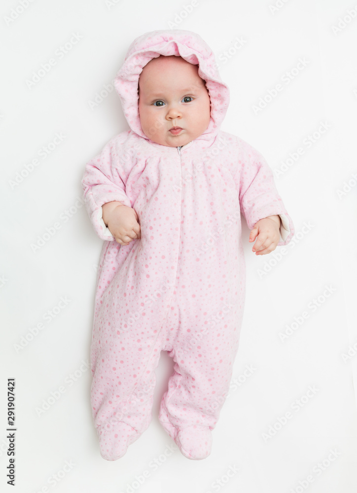 Cute baby dressed in warm overall for winter cold weather. Cute baby dressed in warm overall for winter cold weather.