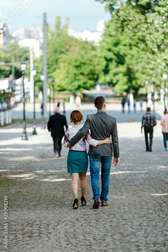 Young couple embrace the streets of the city.