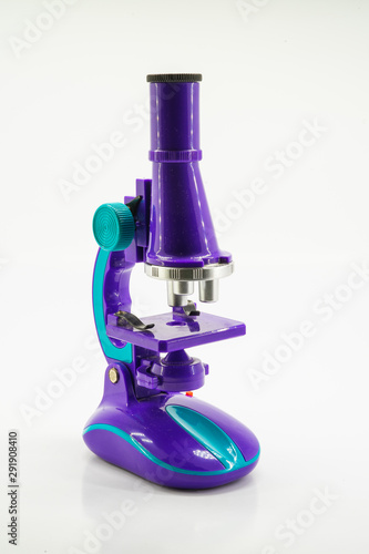 Purple microscope isolated on white.