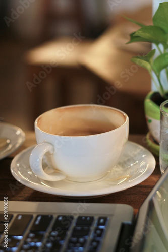 Working in a coffee shop. Laptops were paired with tea, flowers, vases and cakes.Working in a cafe allowing us to enjoy the environment well.