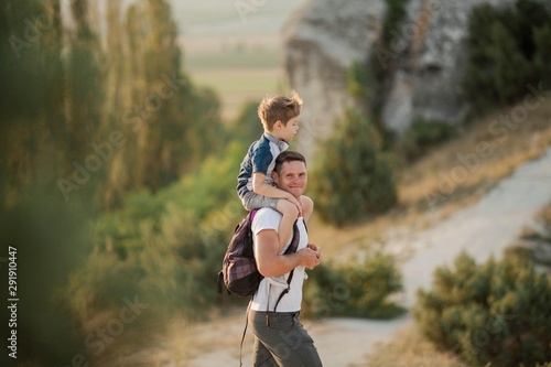 Dad and son in the mountains. Tourism. Campaign. Fall. photo