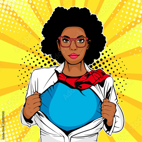 Pop art female afro american superhero. Young sexy woman dressed in white jacket shows superhero t-shirt. Vector illustration in retro pop art comic style.