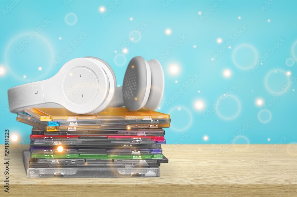 Fotografie Headphones and compact discs  isolated   on background