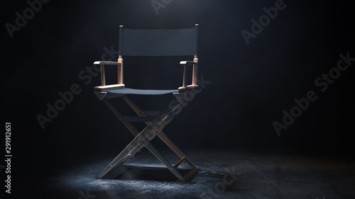 Director Chair, Movie Clapper and Megaphone in the volumetric light on a black background. 3d Rendering photo