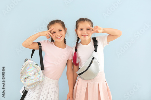 Portrait of cute twin girls...