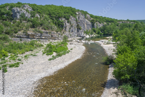Image of Ardèche river and pebble beach during the summer, France.