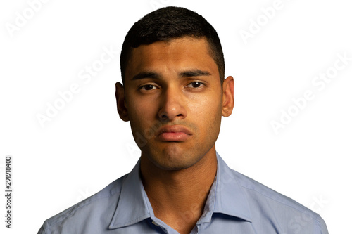 Young worried businessman looking to camera