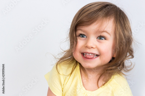 Happy excited smiling emotional baby girl isolated on white background