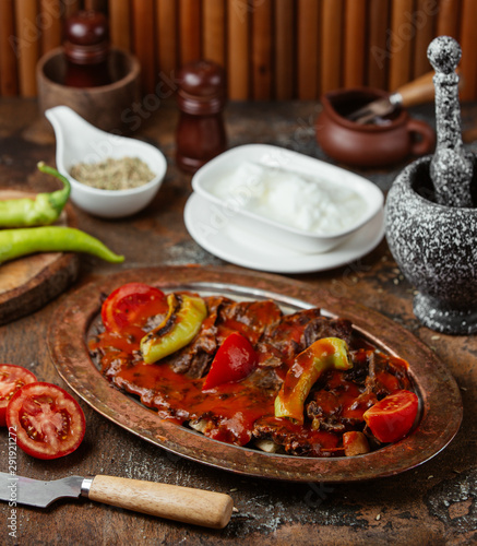 Fried meat in a sauce with vegetables