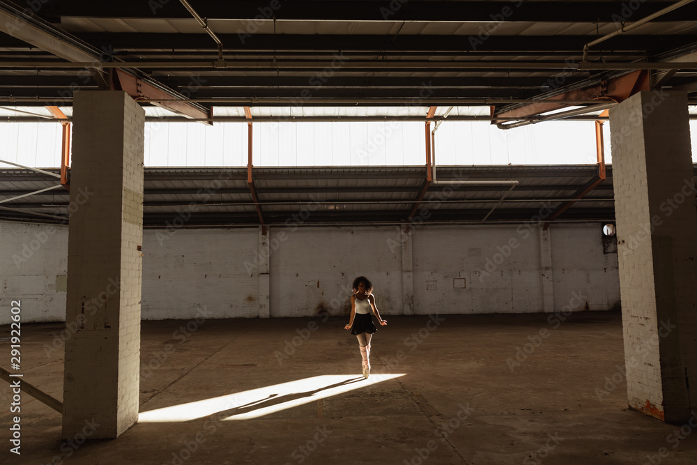 Female dancer in an empty warehouse Female dancer in an empty warehouse