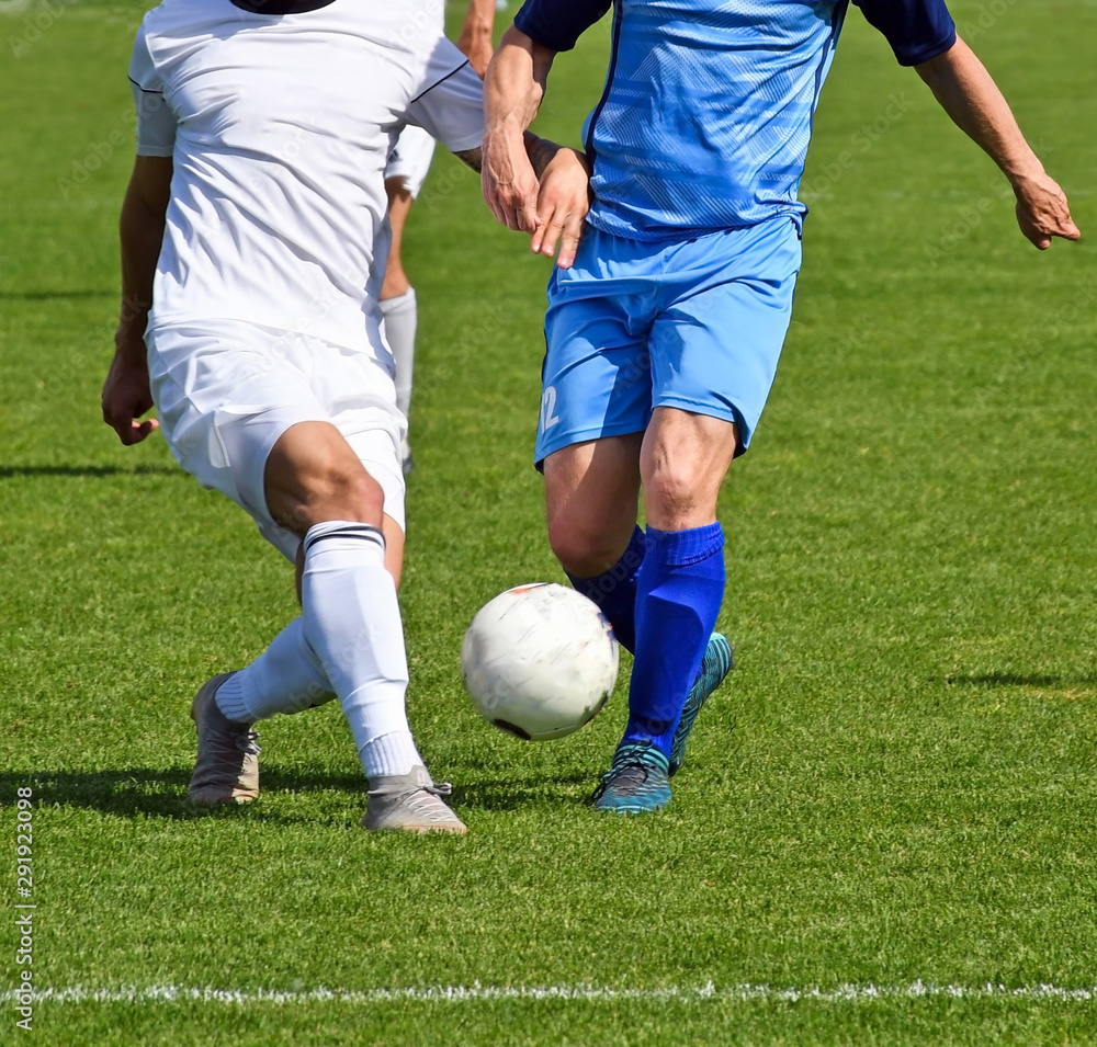 Soccer players in action on the field Soccer players in action on the field